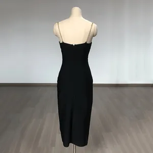 Detailed back view of a black bodycon bandage dress with elegant rhinestone chain straps.
