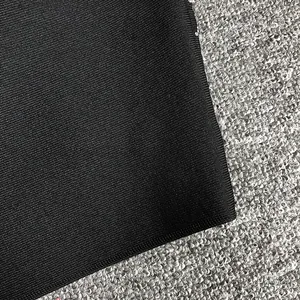Close-up of high-quality black ribbed bandage fabric for sexy crop top