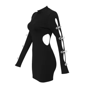 Detail view of black cutout mini dress with sparkling bow accents and ribbed texture