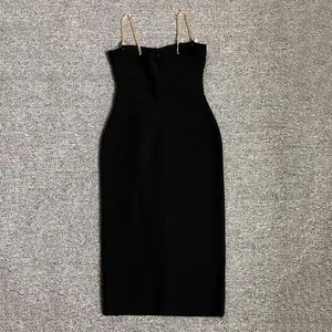 Detailed back view of a sexy black bandage bodycon dress with gold chain straps.