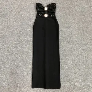 Elegant black strapless bandage maxi dress with rhinestone and metal sunburst accents.