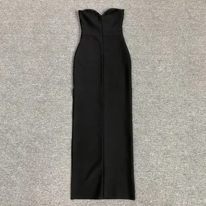 Back view of a long slim-fit strapless black bandage dress with zipper detail