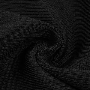 Close-up of black ribbed bandage fabric showing high-quality knit texture