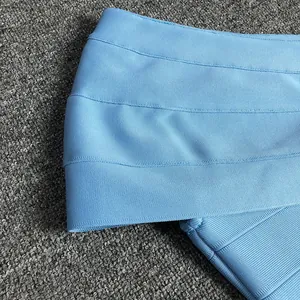 Detailed close-up of light blue bandage dress fabric showing high quality texture