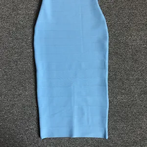 Detailed texture of a light blue bodycon bandage dress with horizontal ribbed patterns