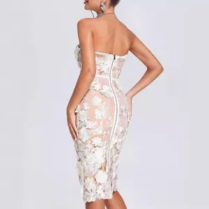 Elegant white strapless lace cocktail dress featuring intricate 3D floral appliqués and back zipper