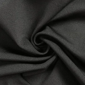 Macro detail of high-elastic black bandage dress fabric showing fine ribbed texture