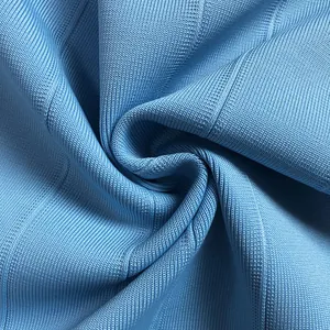 Close-up detail of high-quality light blue ribbed bandage fabric texture.
