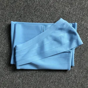 Detail view of light blue bandage dress fabric showing the textured horizontal ribbing.