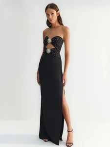 Elegant strapless black bandage maxi dress with gold stud and sunburst metal accents
