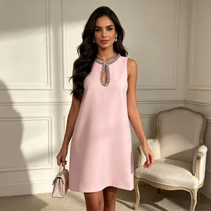 Full view of pink sleeveless mini dress with rhinestone-embellished keyhole neckline.