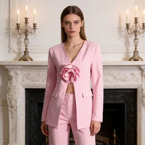Elegant pink slim-fit blazer featuring a large 3D flower embellishment and V-neckline.