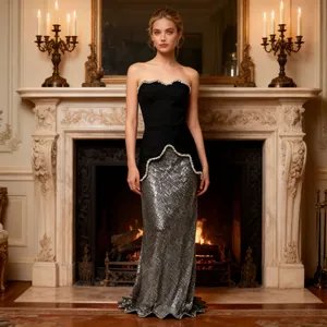 Detailed view of French style evening dress with beaded strapless top and silver sequin skirt