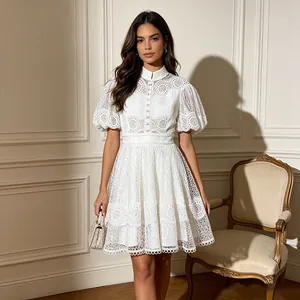 Full body shot of elegant white lace dress with bubble sleeves in luxury room setting