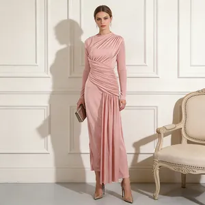 Full-length view of elegant pink pleated maxi dress with sophisticated ruching details
