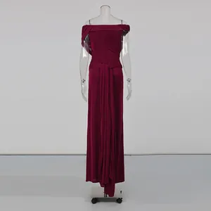 Back view of burgundy off-the-shoulder maxi dress featuring elegant pleated tie detail.