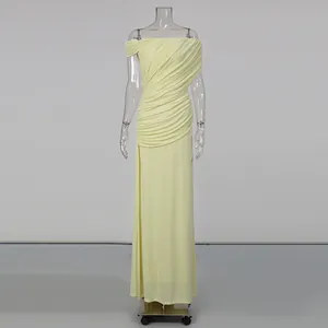 Detailed view of the elegant ruched off-the-shoulder long dress in pale yellow.