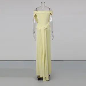 Detailed back view of a light yellow off-the-shoulder pleated maxi dress on a mannequin