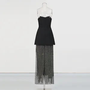 Back view of elegant French style strapless black top and shimmering sequin maxi skirt