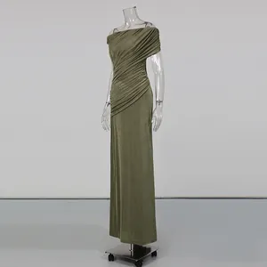 Detailed view of the elegant olive green ruched off-the-shoulder maxi dress silhouette