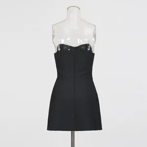 Back view of a chic black strapless dress set displayed on a transparent mannequin stand