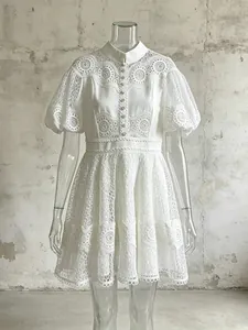 Elegant white high waist dress featuring puff sleeves and intricate lace embroidery