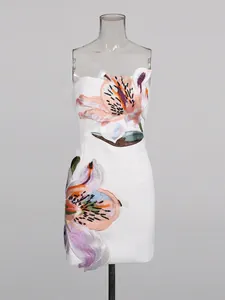 Elegant white strapless mini dress featuring sophisticated heavy floral embroidery and applique