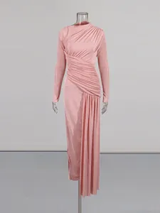 Elegant pink pleated bodycon maxi dress featuring long sleeves and ruched side detailing
