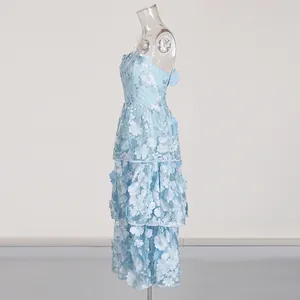 Side profile of a light blue strapless maxi dress featuring 3D floral embroidery details