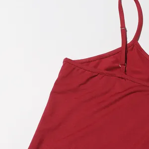 Close-up detail of the adjustable strap and neckline of a red fashionable dress.
