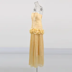 Elegant pale yellow strapless ruffled long dress with peplum detail for women