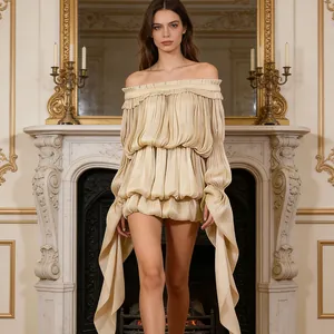 Detail view of champagne off-the-shoulder resort dress with ruffled tiers and streamers