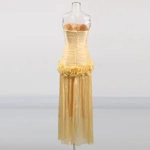 Detailed back view of elegant yellow strapless long dress with ruffled waist design