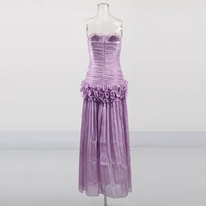Back view of a lavender sleeveless strapless maxi dress with ruffled waist details