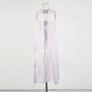 Back view of lavender halter dress with long streamers and silver fringe.