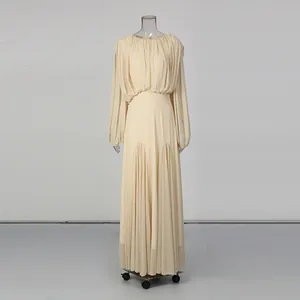 Elegant beige round neck pleated long sleeve dress featuring minimalist design aesthetics