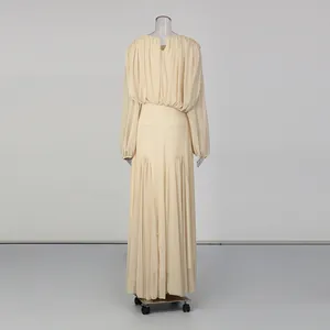 Back view of elegant beige pleated long sleeve maxi dress in minimalist style