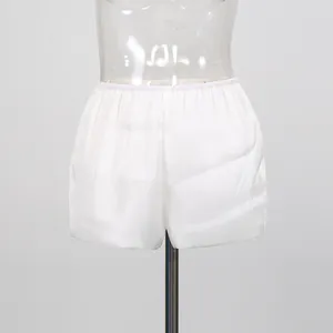 Detailed view of white ruffled safety shorts for resort style dresses and skirts