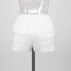 Close-up detail view of white elastic waist safety shorts for resort style dresses