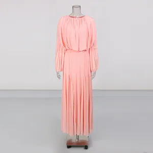 Professional full-length shot of a pink pleated maxi dress with long sleeves on mannequin