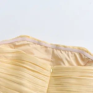 Close-up detail of strapless elegant evening dress showing non-slip strip and zipper closure