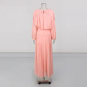 Elegant peach round neck long sleeve pleated maxi dress, back view detail on mannequin.