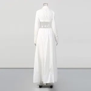 Back view of minimalist white long sleeve crop top and long skirt set on mannequin