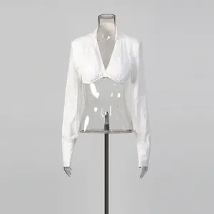 Elegant minimalist white cropped long-sleeved top featuring a deep V-neck and stylish design