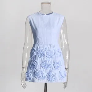 Detailed shot of French retro style light blue striped dress with 3D floral appliqués