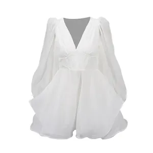 Detailed view of the mesh texture and fishbone waist on this white V-neck mini dress