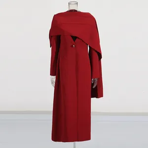 Elegant red long coat featuring a unique shawl-style overlay and sleek V-neckline