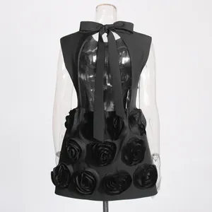 Elegant black mini dress featuring 3D rose appliqués and back bow detail