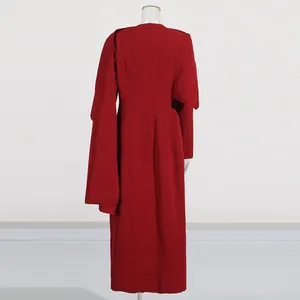 Detailed back view of an elegant red shawl-style long coat with a tailored waist.