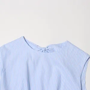 Close-up detail of the back knot neckline on a French retro blue striped dress